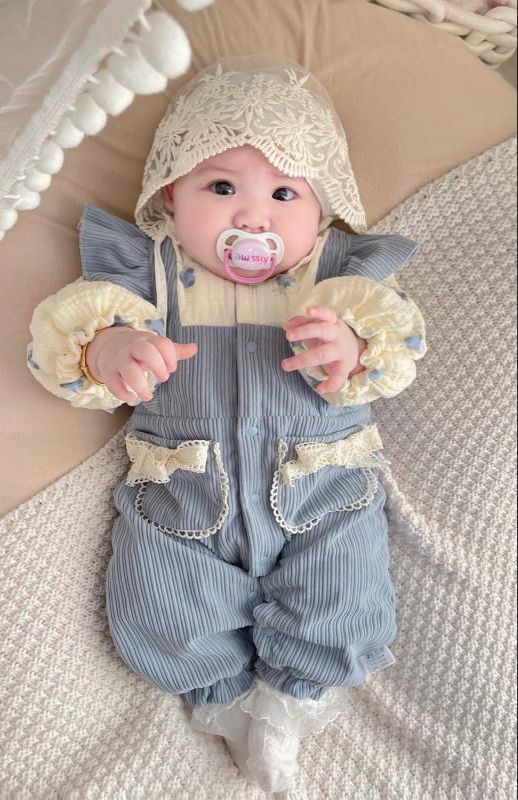 Blue corduroy romper with bow